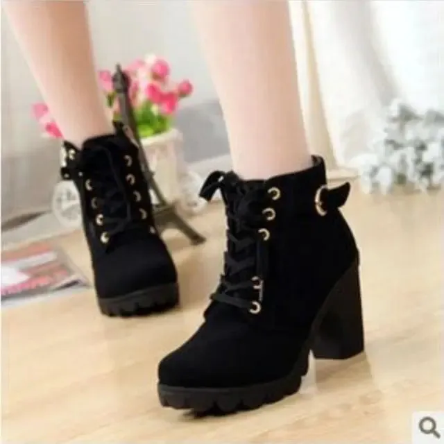 High-heeled boots with elegant laces and a woman's side zipper.
