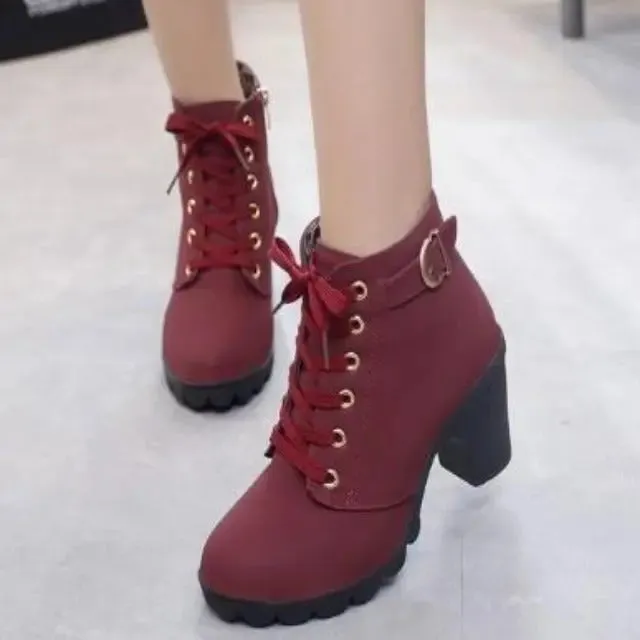 High-heeled boots with elegant laces and a woman's side zipper.